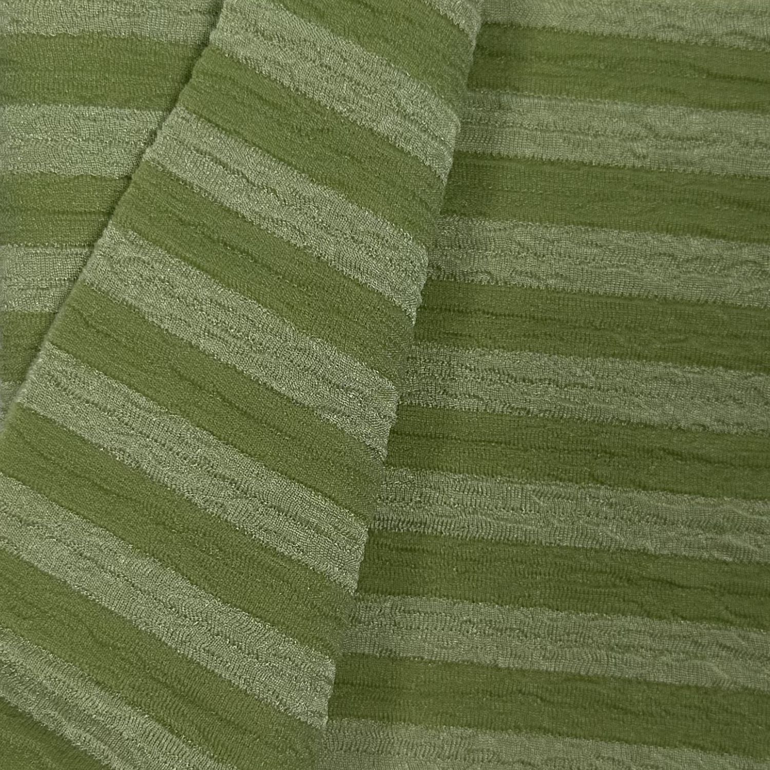 Close-up of green textured fabric with diagonal stripes