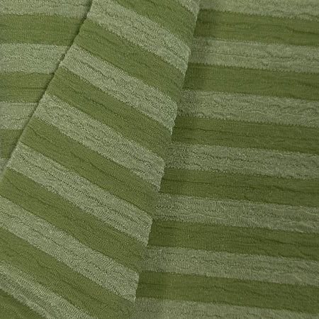 Close-up of green textured fabric with diagonal stripes
