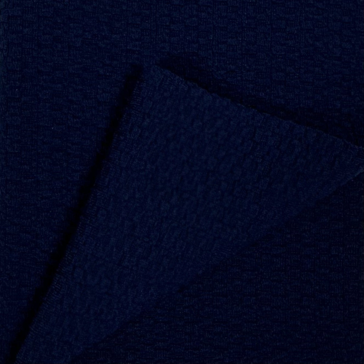 Navy blue fabric texture with a subtle pattern