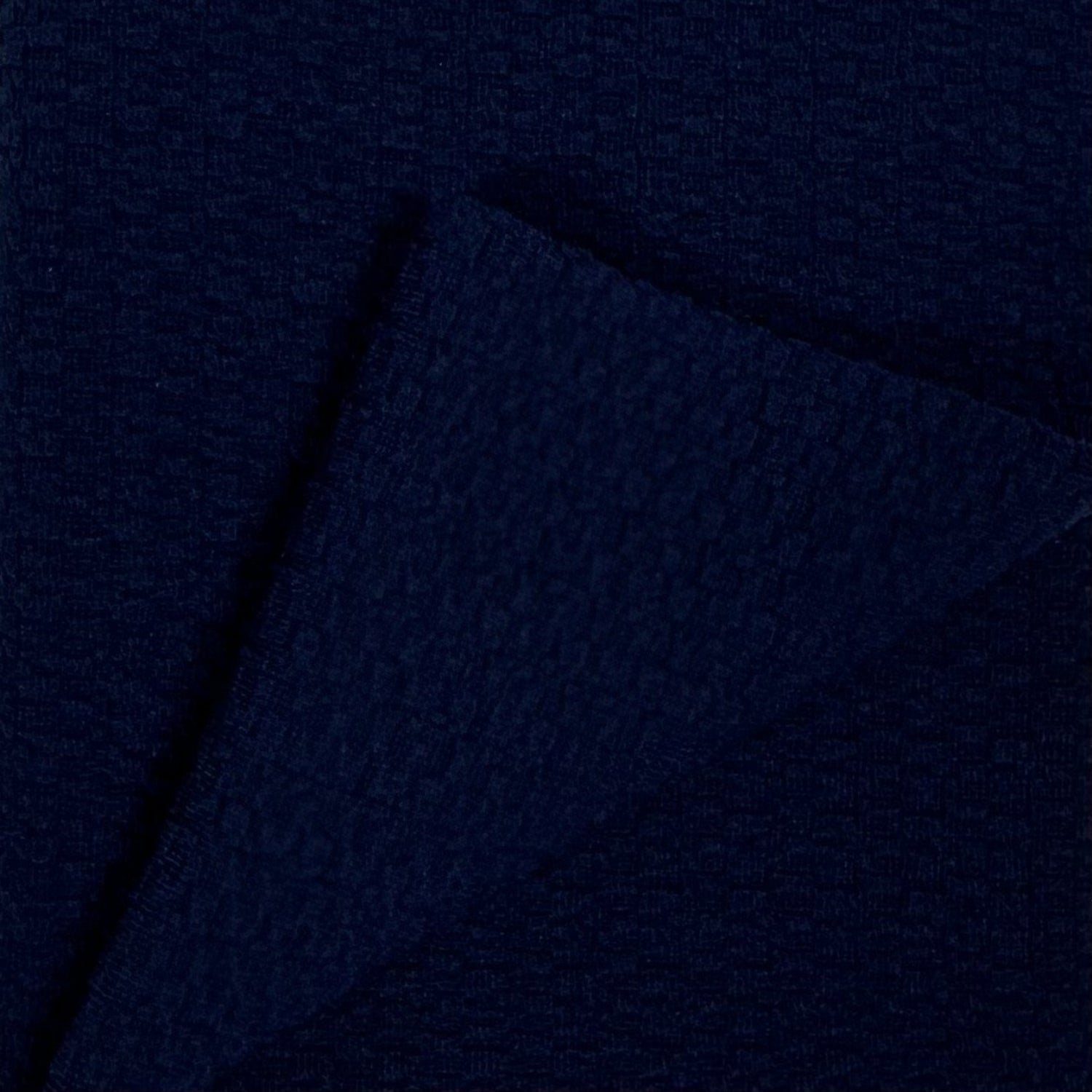 Navy blue fabric texture with a subtle pattern