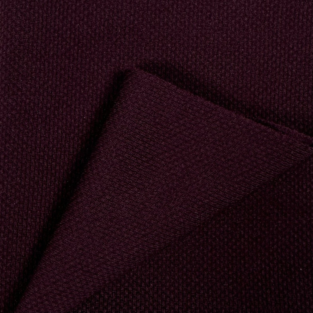 Close-up of dark purple fabric texture