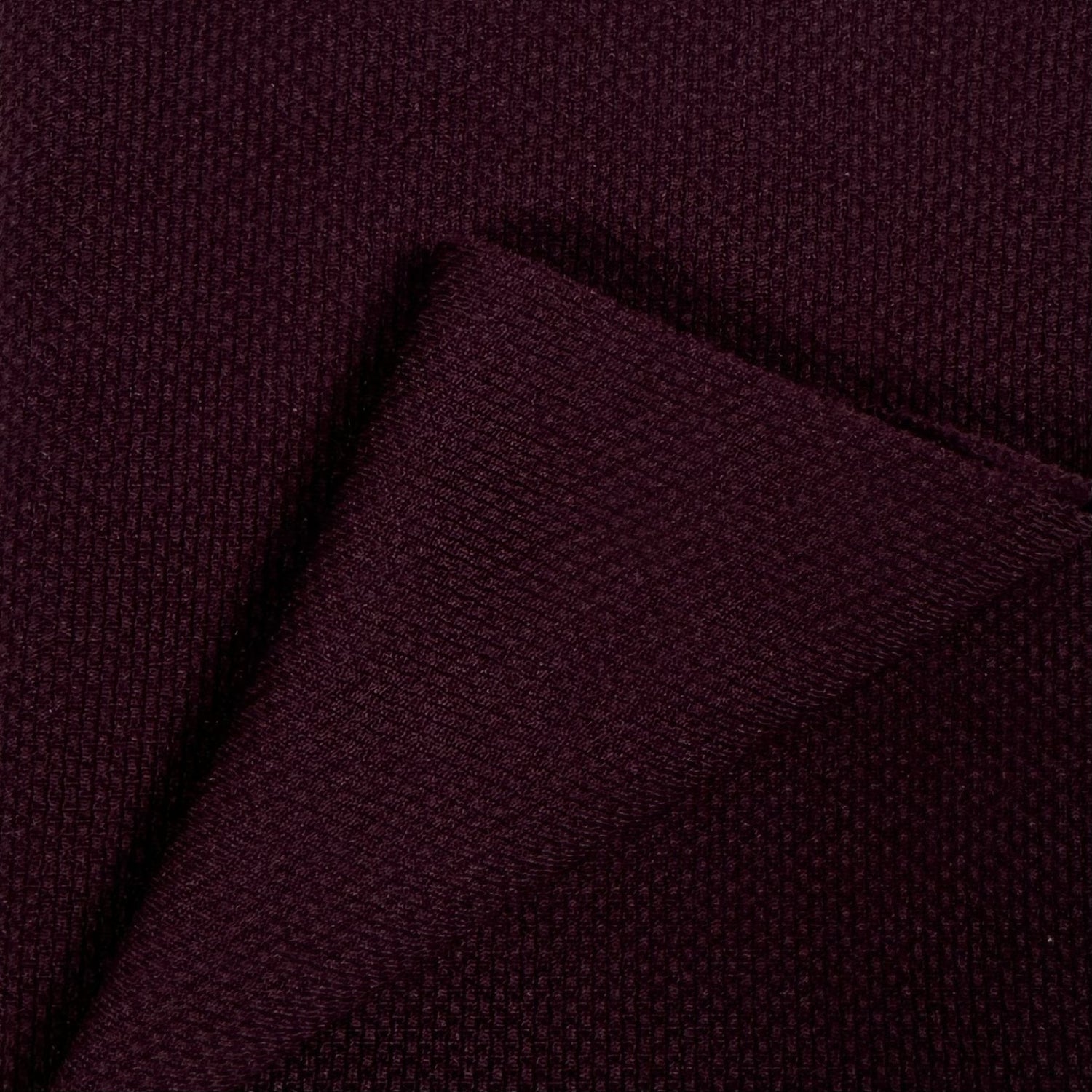 Close-up of dark purple fabric texture