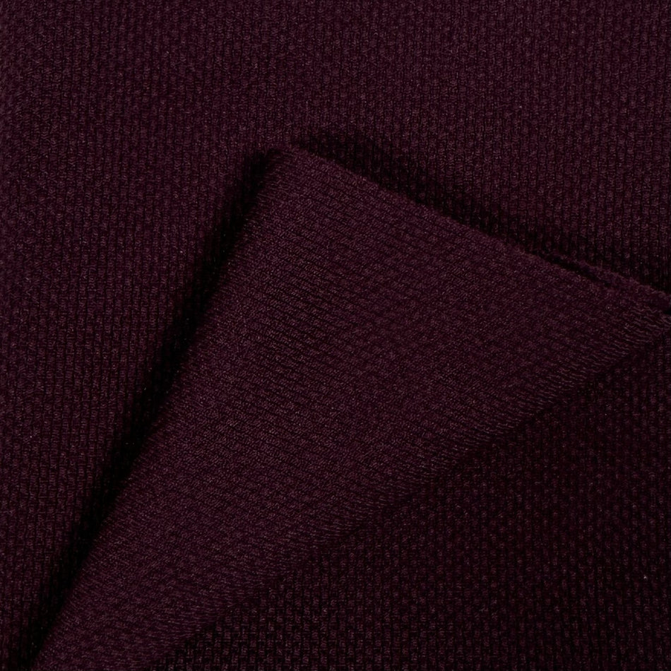 Close-up of dark purple fabric texture