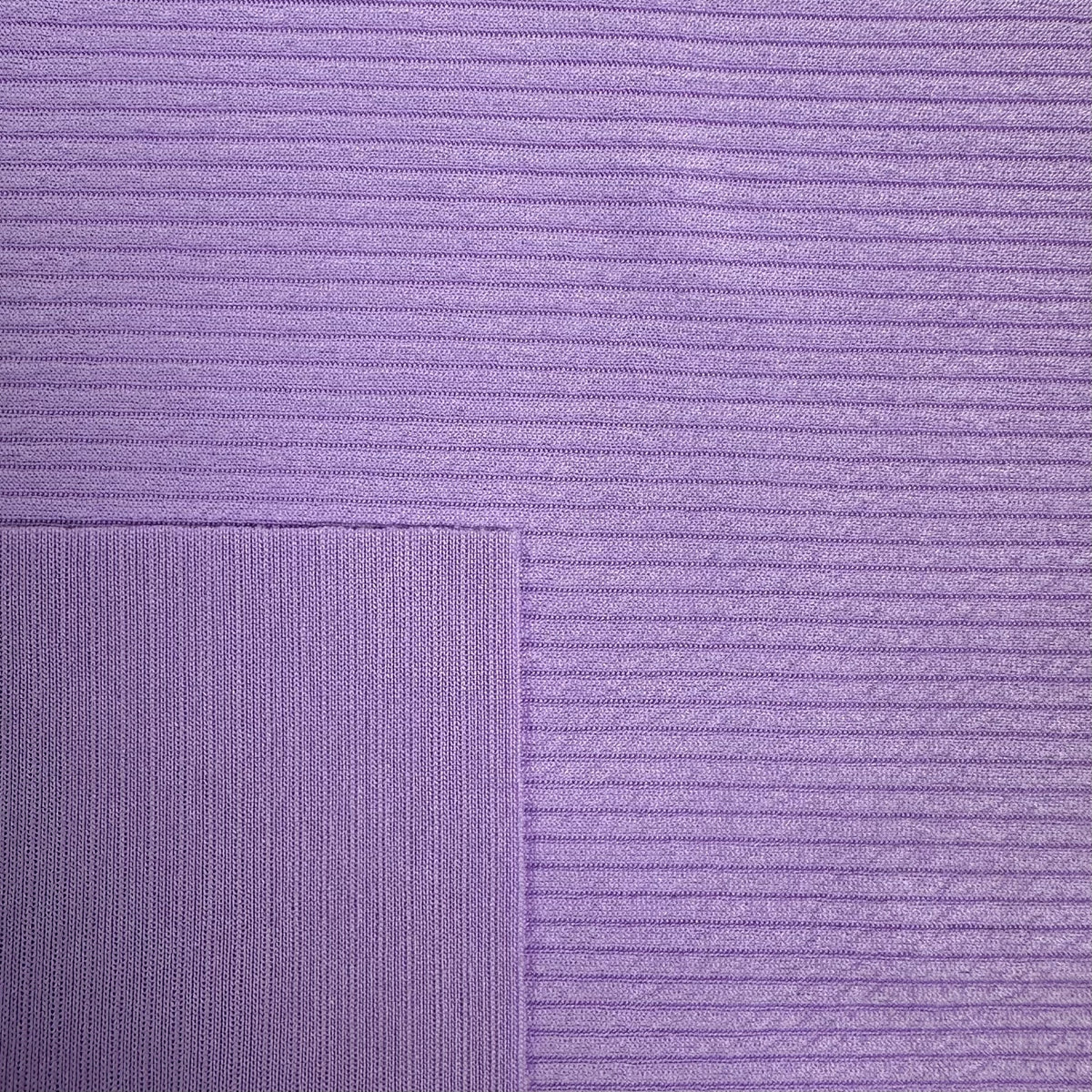 Close-up of purple fabric with a subtle pattern