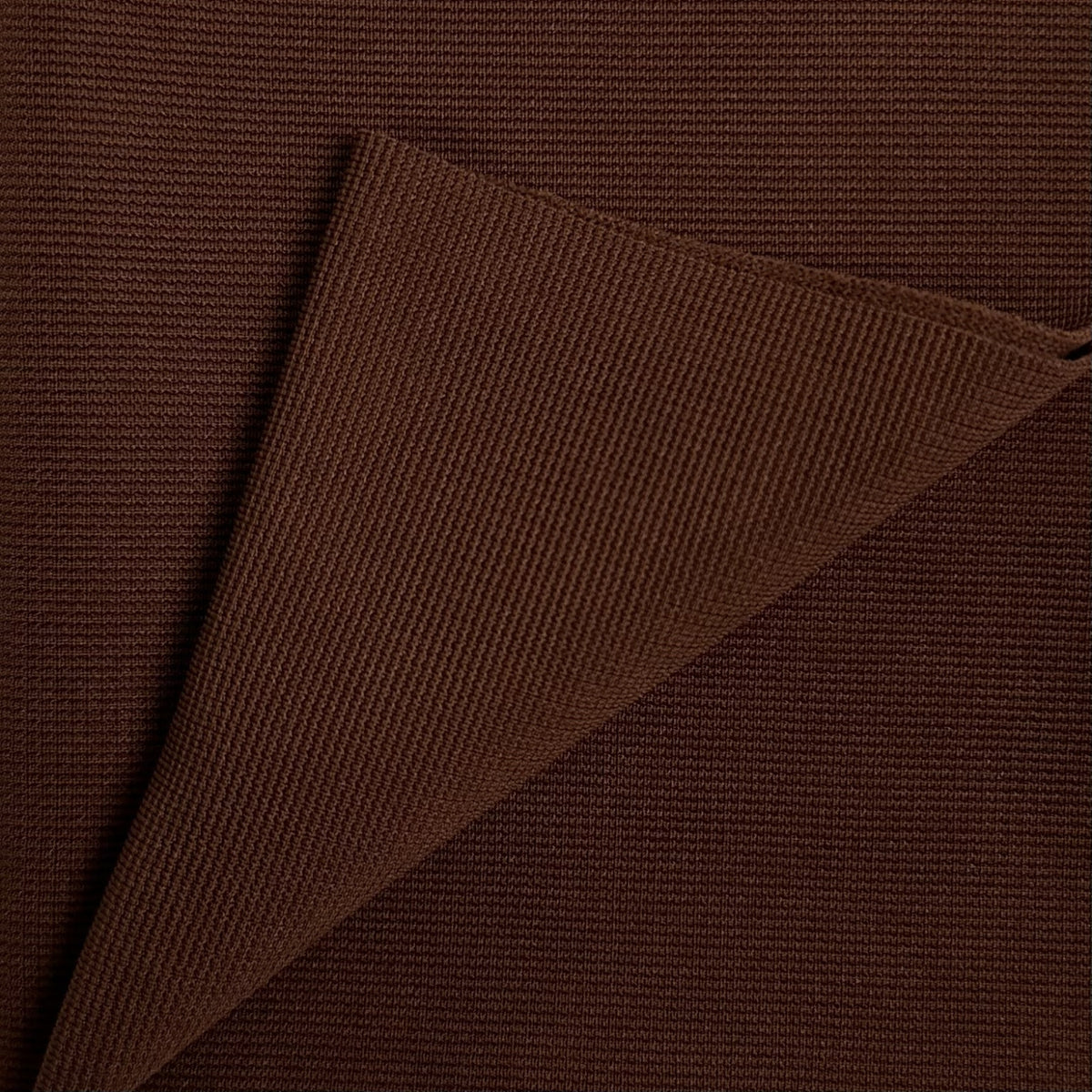 Brown fabric with a textured pattern