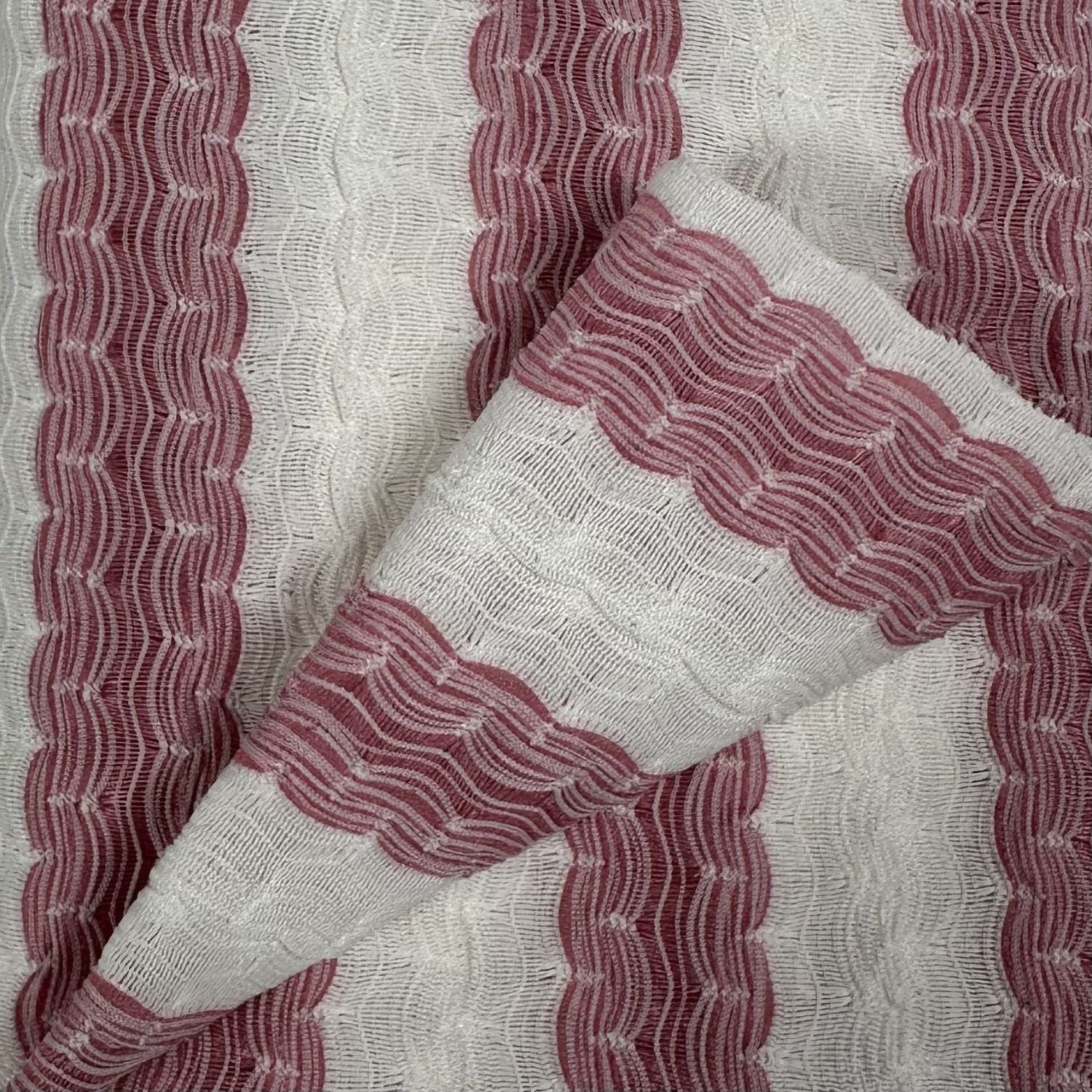 Close-up of fabric with red and white wavy pattern