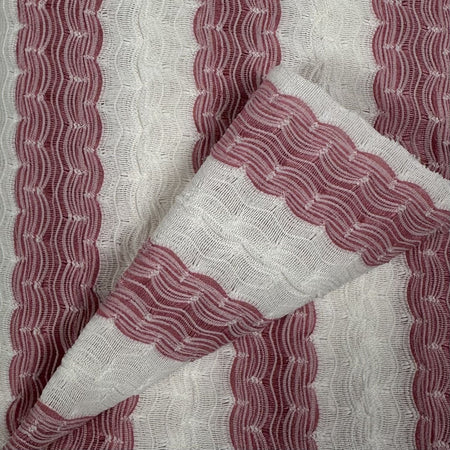 Close-up of fabric with red and white wavy pattern