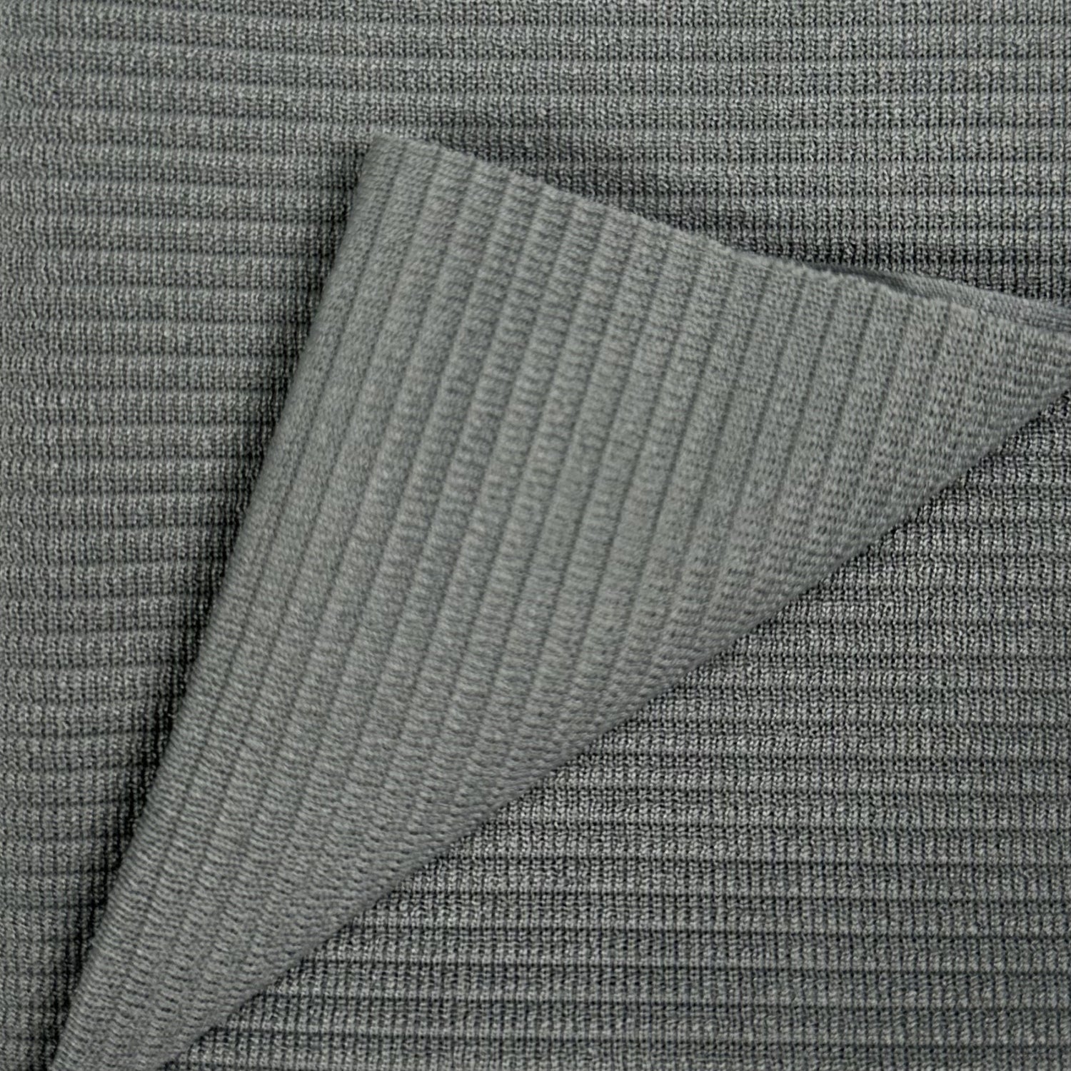 Close-up of textured gray fabric with a diagonal pattern