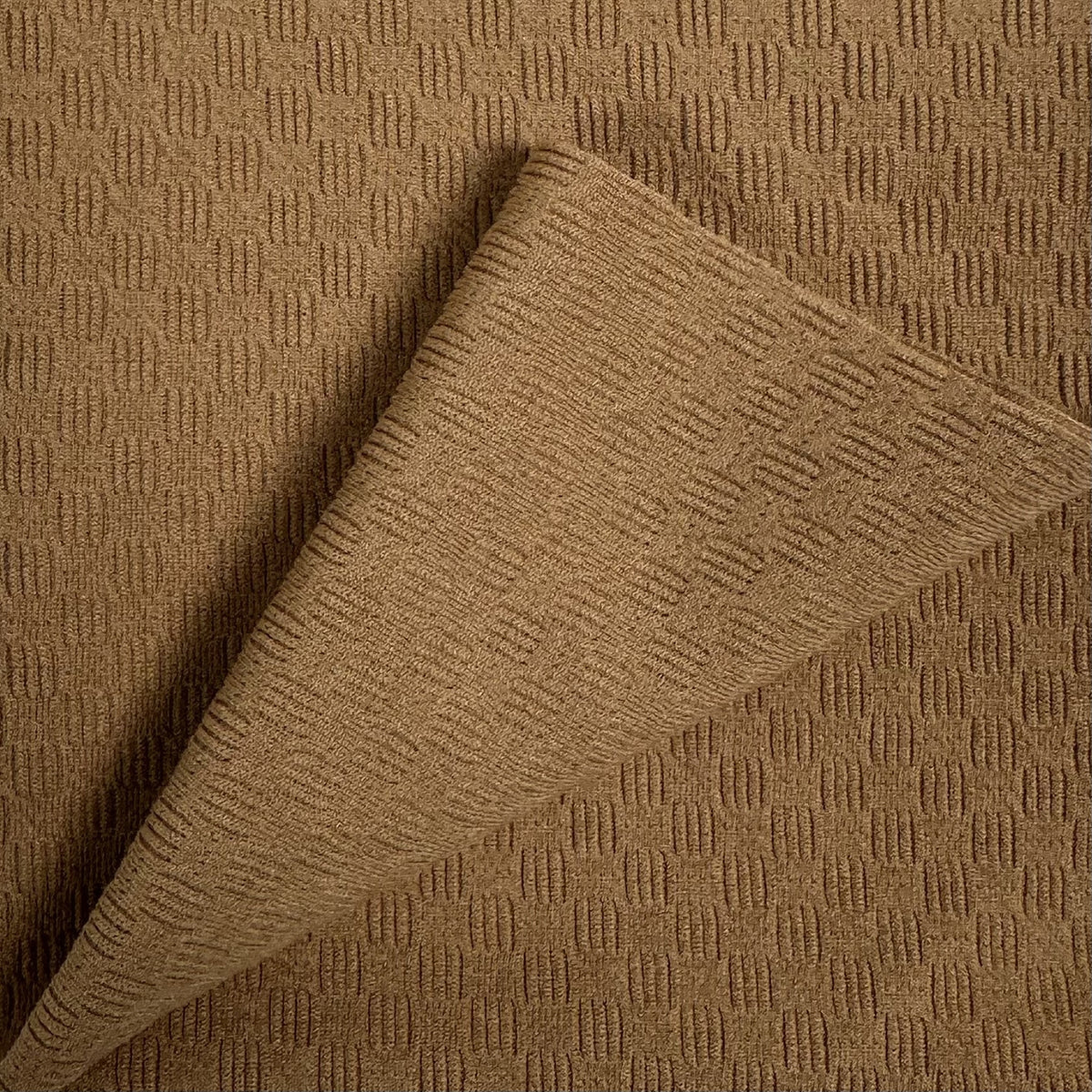 Brown textured fabric with a geometric pattern