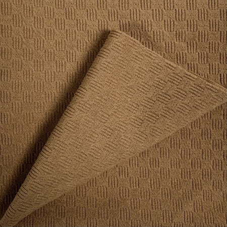 Brown textured fabric with a geometric pattern