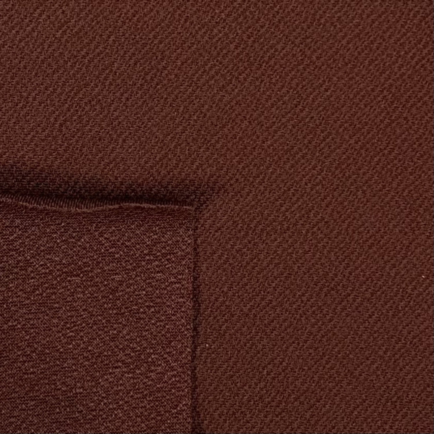 Close-up of brown fabric with a subtle pattern