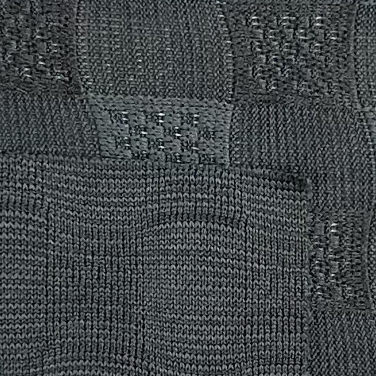 Dark gray textured fabric with a brand label.