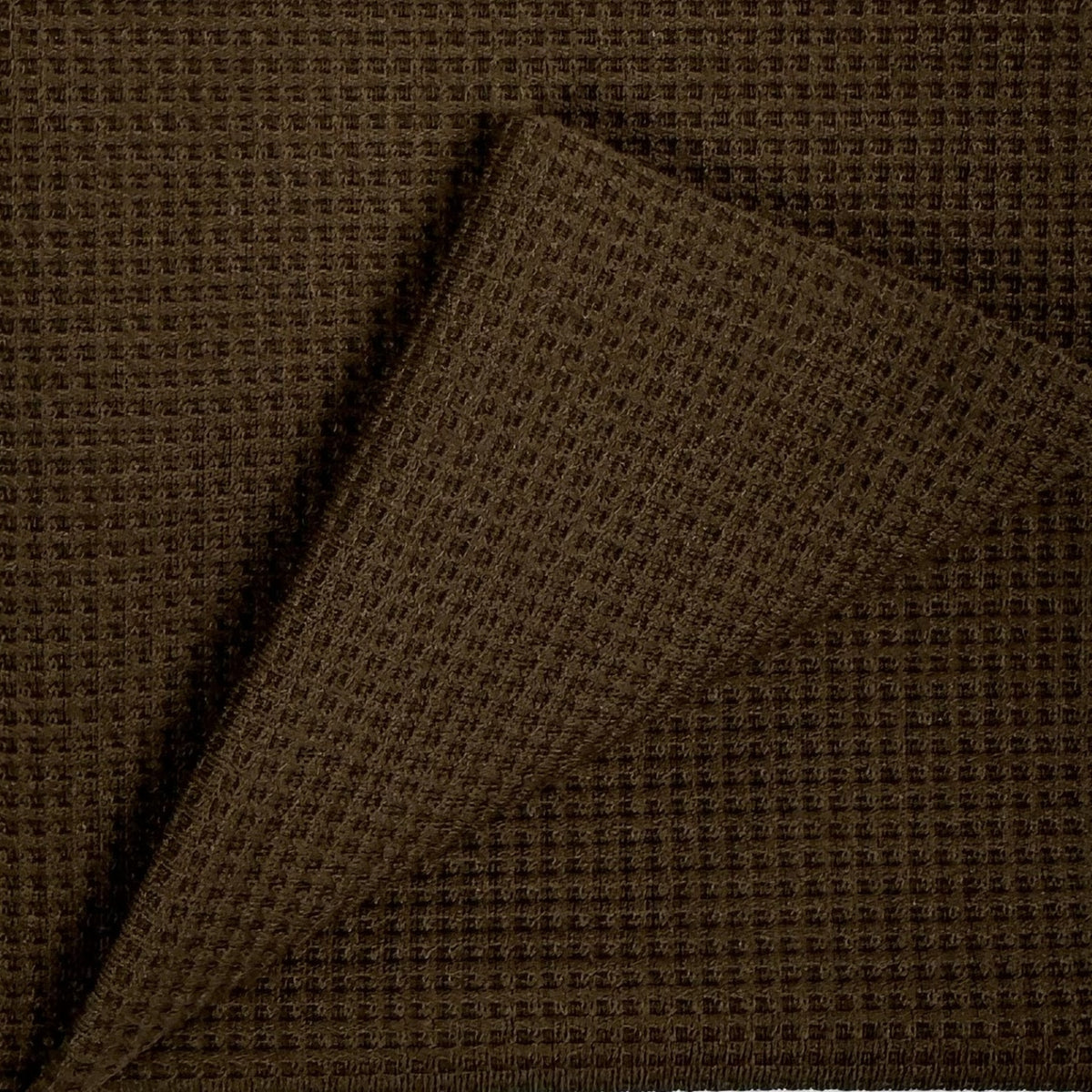 Brown textured fabric with a diagonal pattern