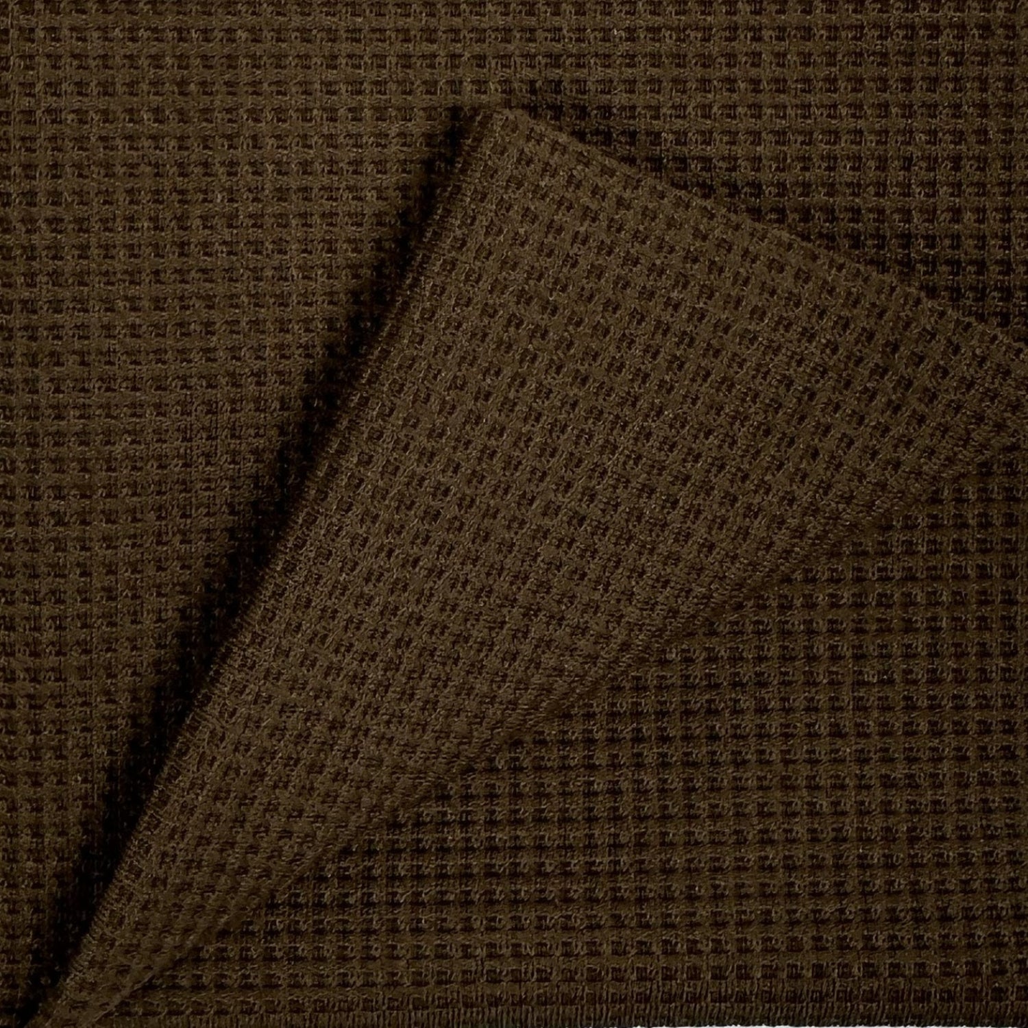 Brown textured fabric with a diagonal pattern