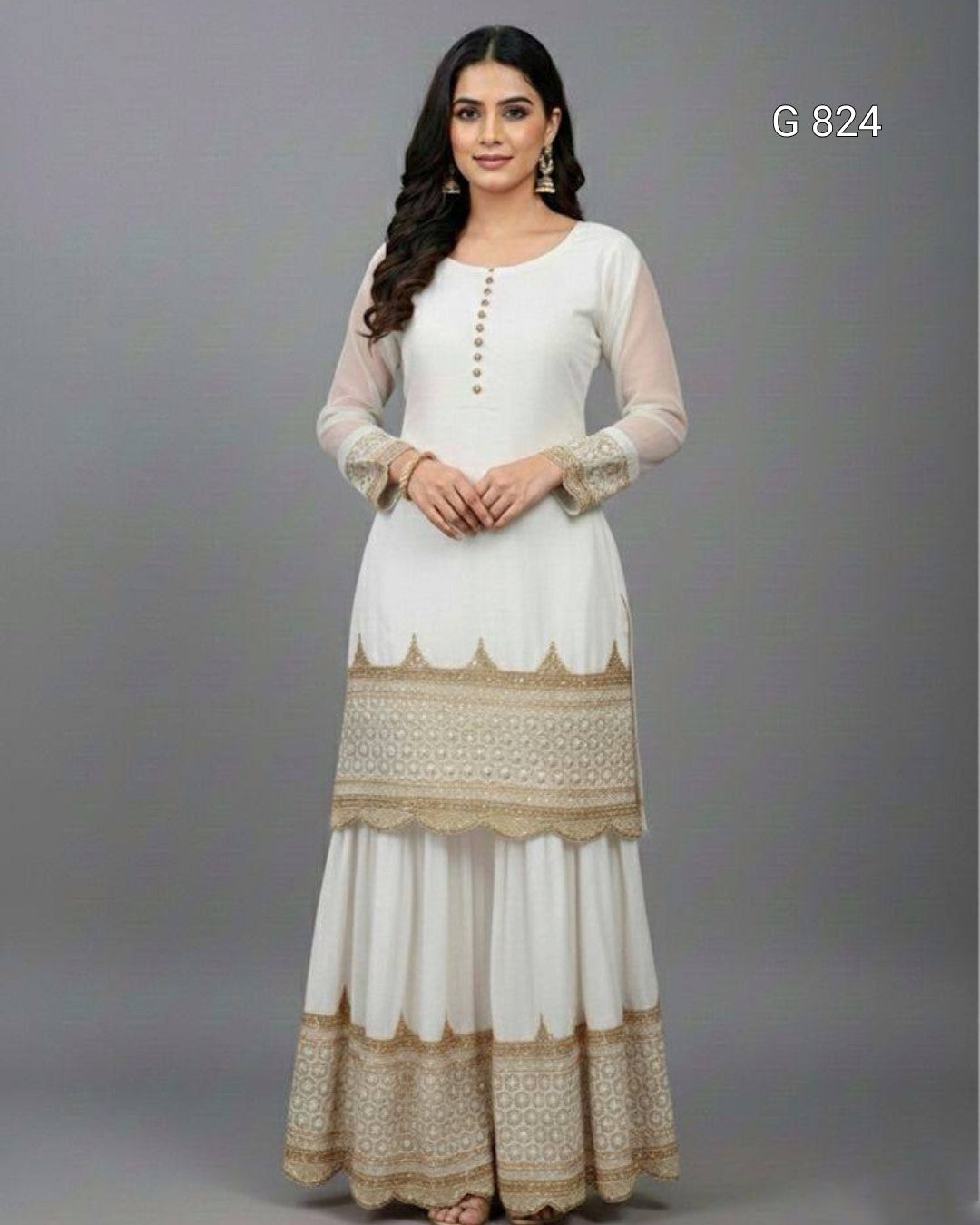 Woman wearing a white and beige traditional outfit with intricate patterns on a gray background