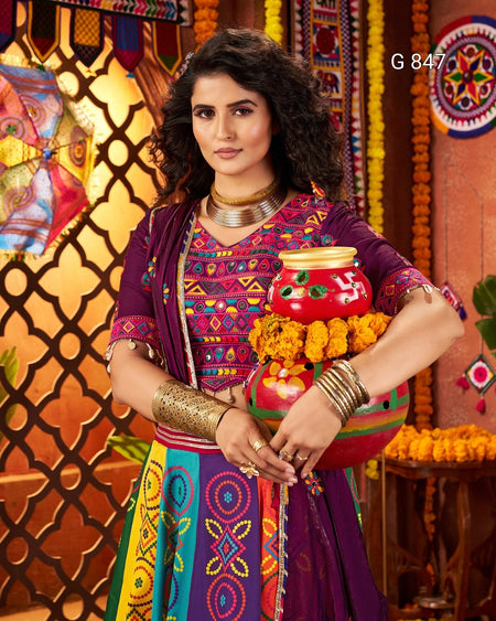 Woman in traditional colorful attire holding a decorative pot against a vibrant background