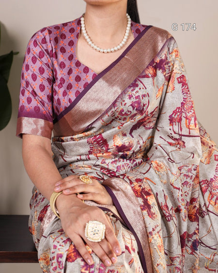 Woman wearing a patterned saree with a pearl necklace and gold jewelry.