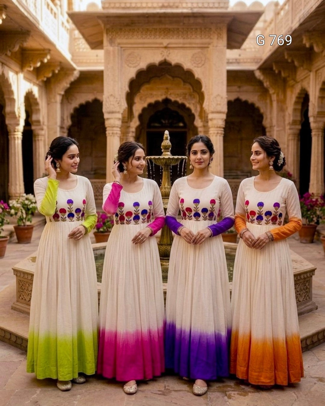 Four women in matching dresses with colorful下半部分在印度风格的庭院中