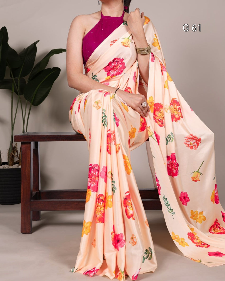 Woman wearing a floral saree with a plain background