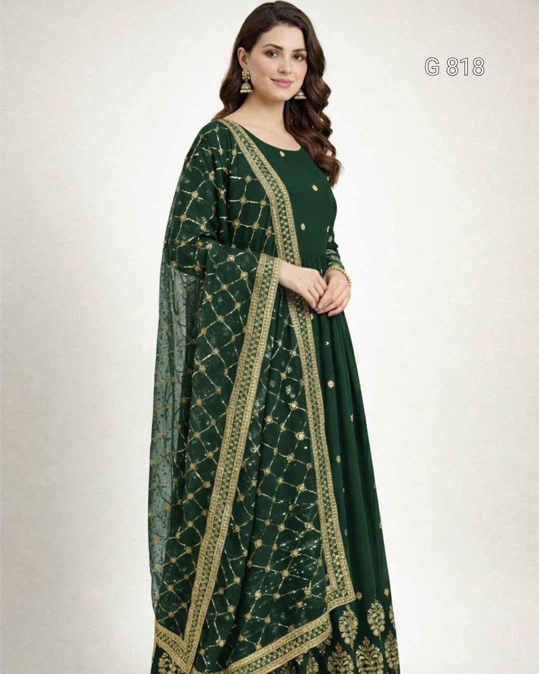 Woman wearing a green traditional outfit with gold patterns on a white background