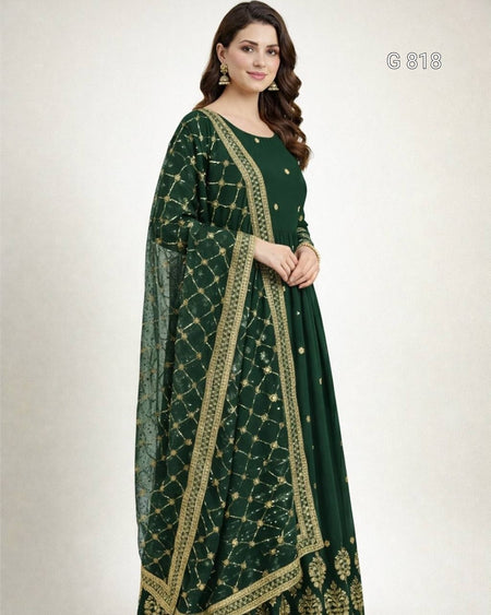 Woman wearing a green traditional outfit with gold patterns on a white background