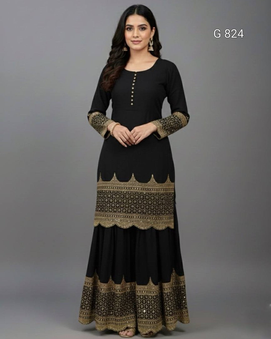 Woman wearing a black dress with gold patterns on a gray background