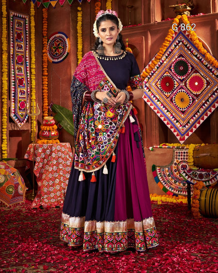 Woman in traditional outfit with colorful decorations in a festive setting