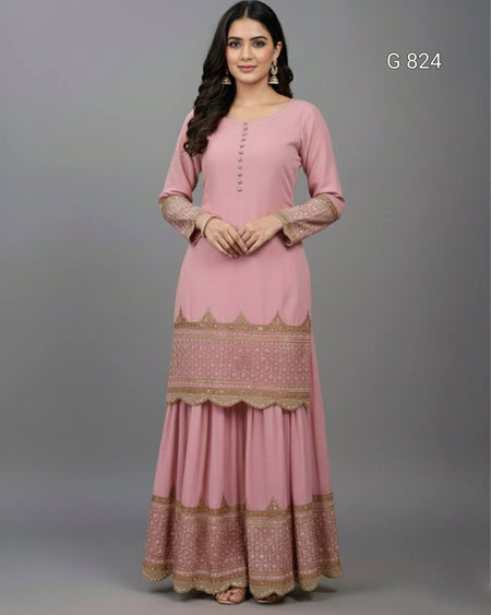 Woman wearing a pink traditional outfit with gold patterns on a gray background