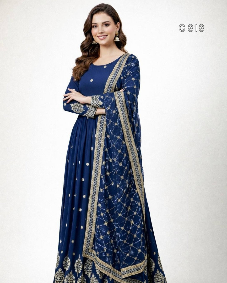 Woman wearing a blue embroidered dress with a white background