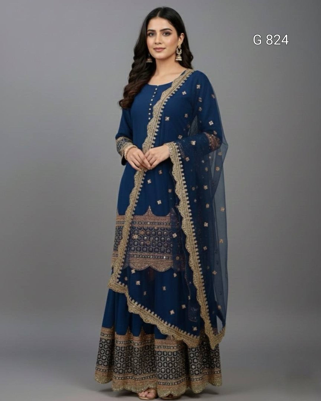 Woman wearing a blue traditional outfit with gold embroidery on a gray background