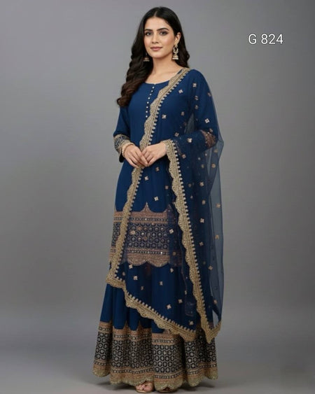 Woman wearing a blue traditional outfit with gold embroidery on a gray background