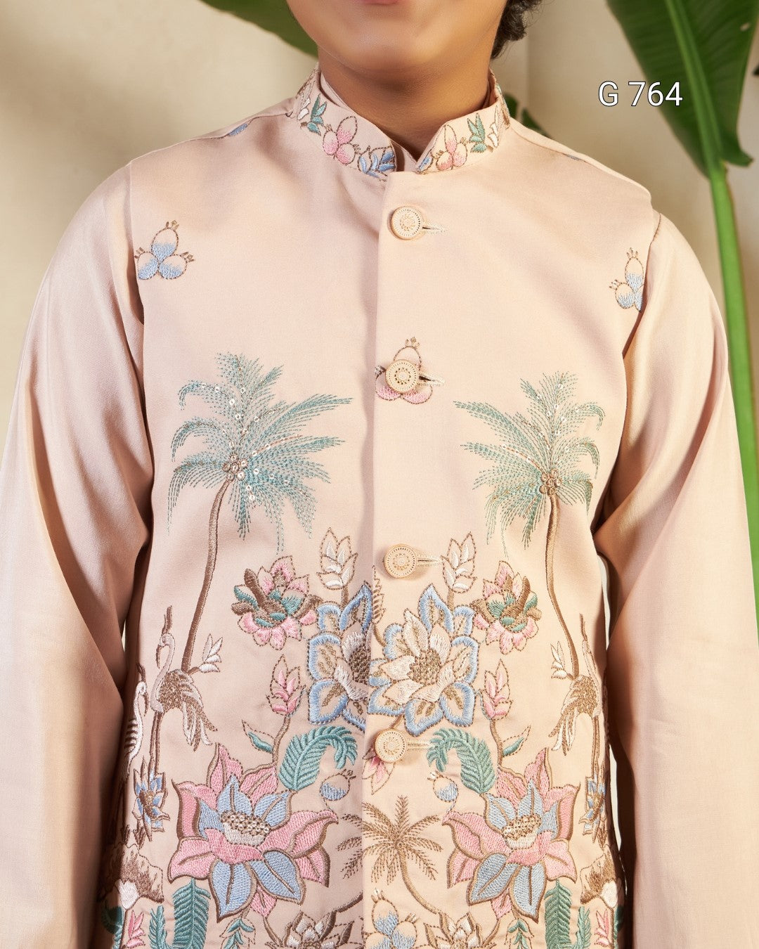 Traditional embroidered shirt with floral and palm tree patterns on a beige background