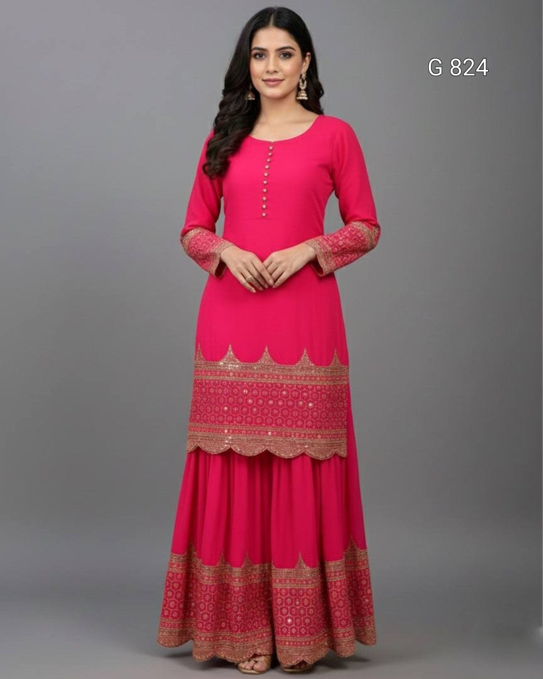 Woman wearing a pink traditional outfit with intricate patterns on a gray background