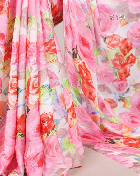 Floral fabric with pink roses and colorful leaves on a white background