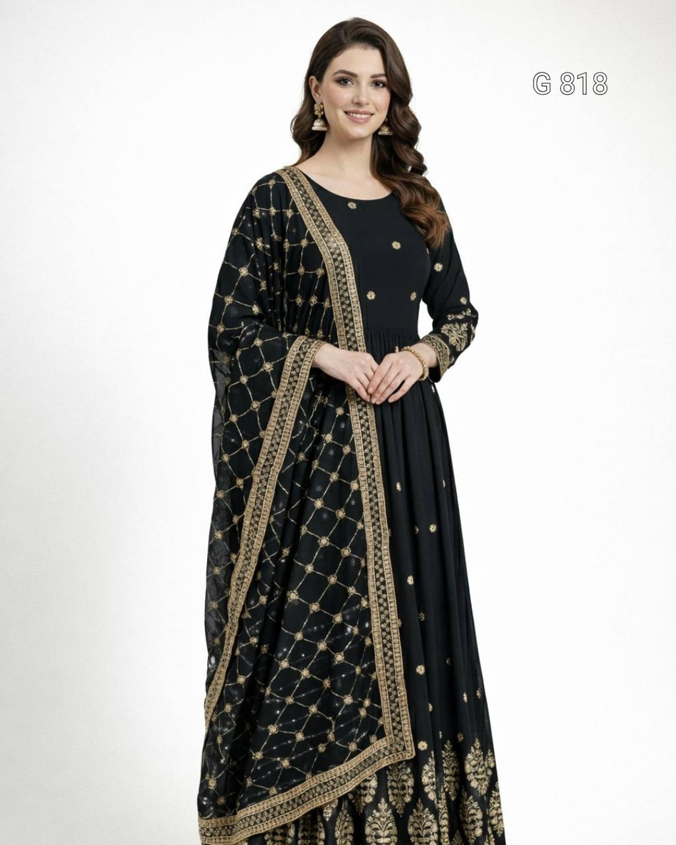 Woman wearing a black and gold saree with a white background