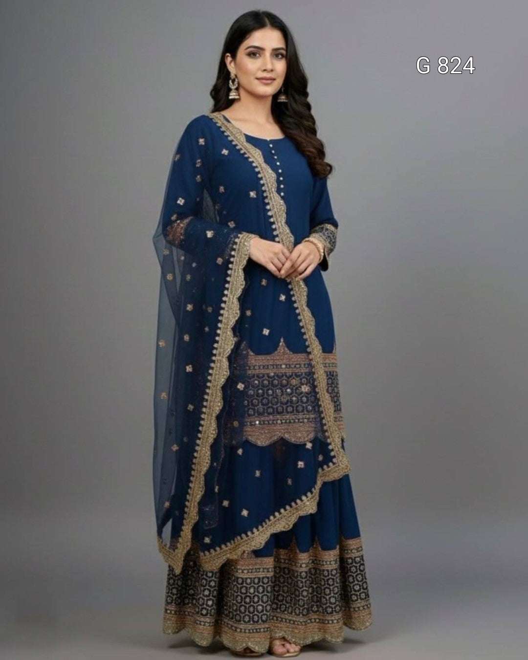 Woman wearing a blue traditional outfit with gold patterns on a gray background