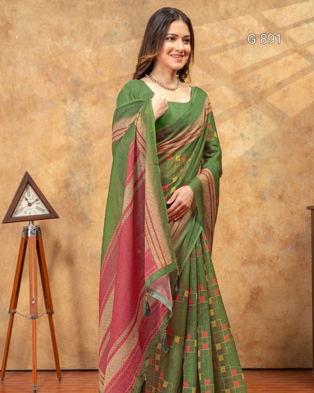 Woman wearing a green and red saree with a decorative background