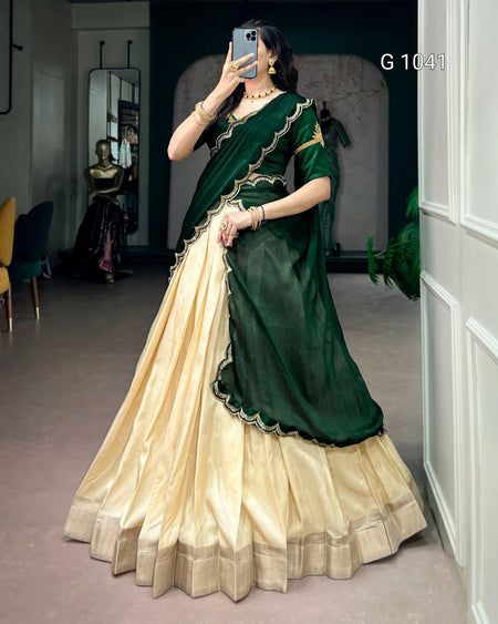 A woman takes a mirror selfie wearing a traditional Indian ethnic wear set consisting of a dark green dupatta with gold border, a pleated cream skirt, and a matching cream blouse. The text 'G 1041' is visible in the top right corner.