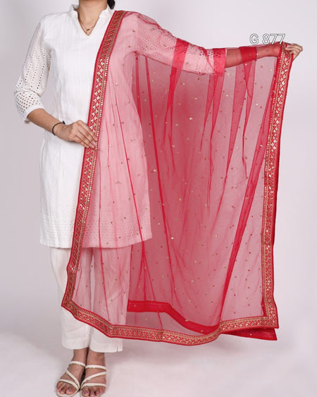 Person wearing a white outfit with a red dupatta on a white background
