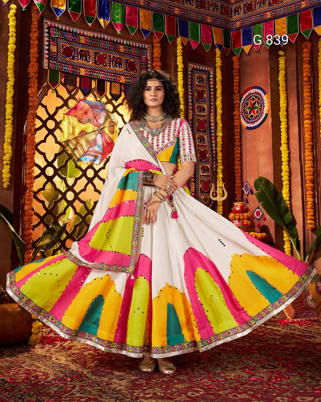 Woman in a colorful traditional outfit with a vibrant background