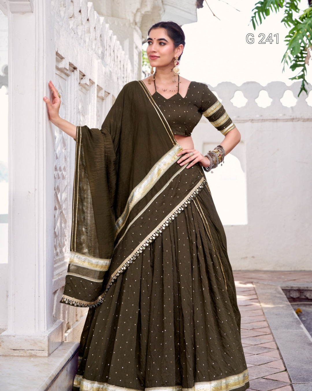 Woman wearing a traditional saree in an outdoor setting