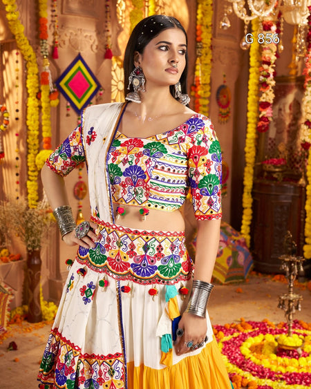 Woman in a colorful traditional outfit with a decorated background