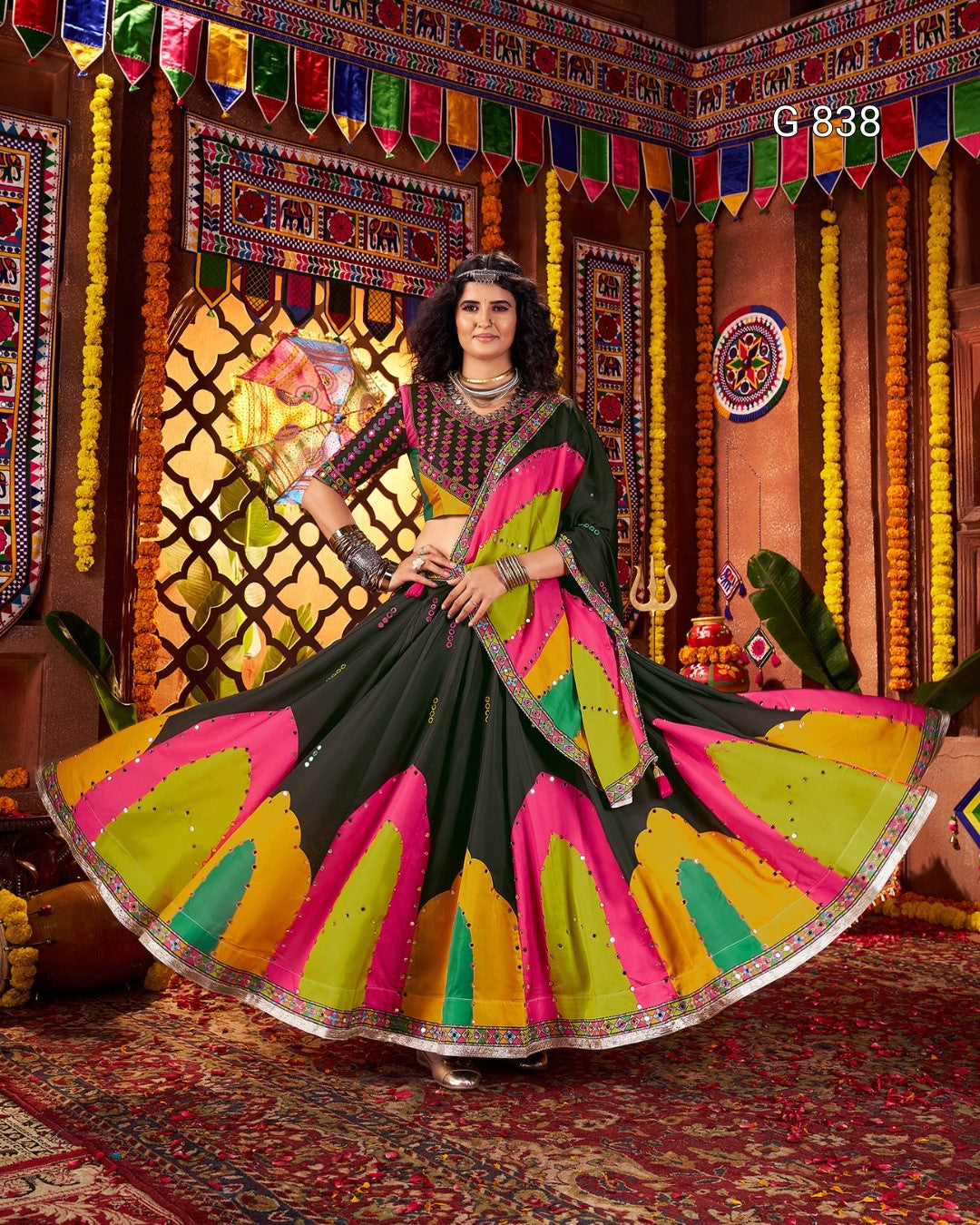 Woman in a colorful traditional outfit with a decorated background