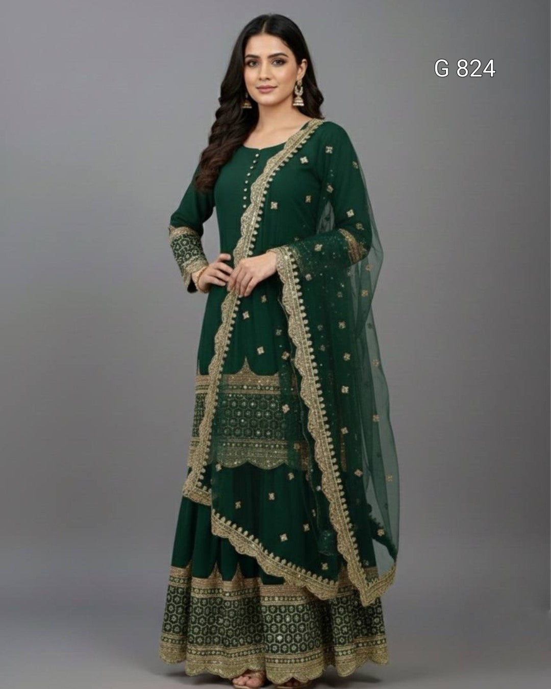 Woman wearing a green traditional outfit with gold embroidery on a gray background