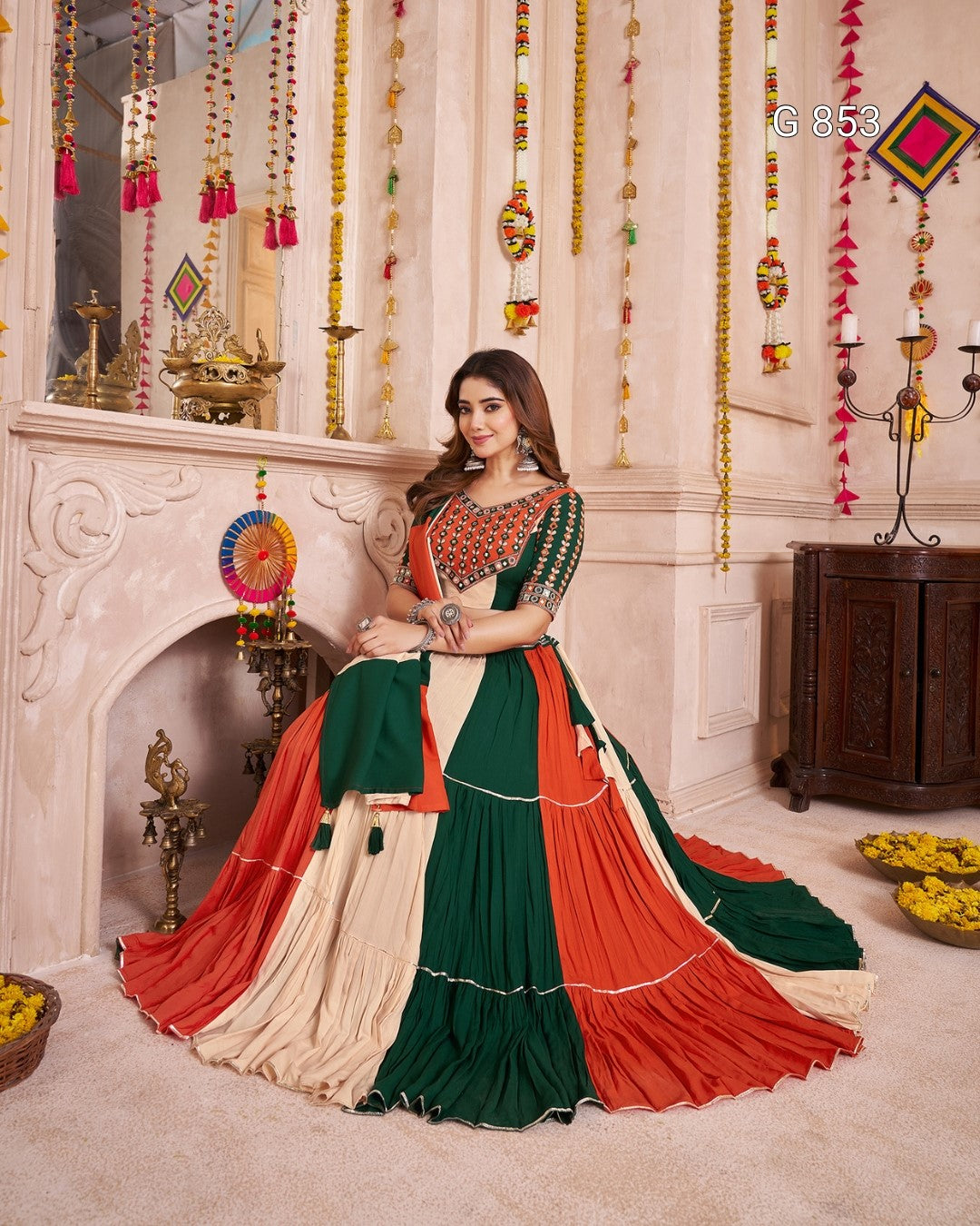 Woman in a traditional saree with a decorative background