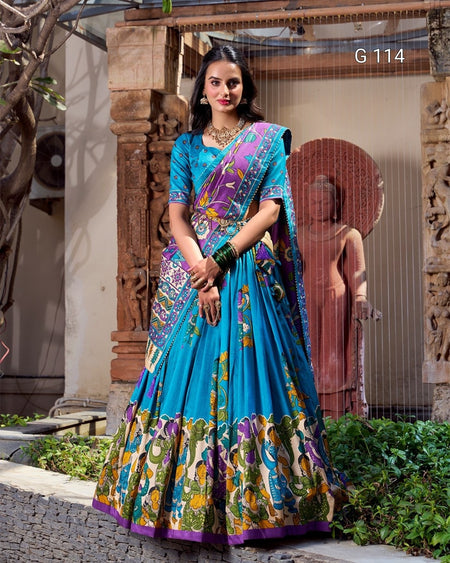 Woman wearing a colorful saree with a traditional setting
