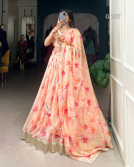 Woman wearing a floral dress in a room with a mirror.