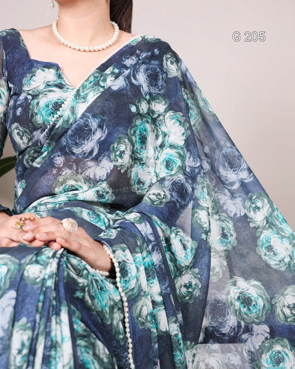 Woman wearing a blue floral saree with a plain background