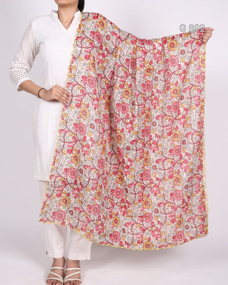 Person holding a floral patterned scarf against a white background