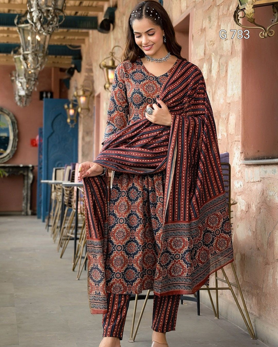 Woman wearing a patterned outfit in an ornate interior setting